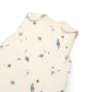 Cream sleeveless sleep bag with planet print, close-up view of front