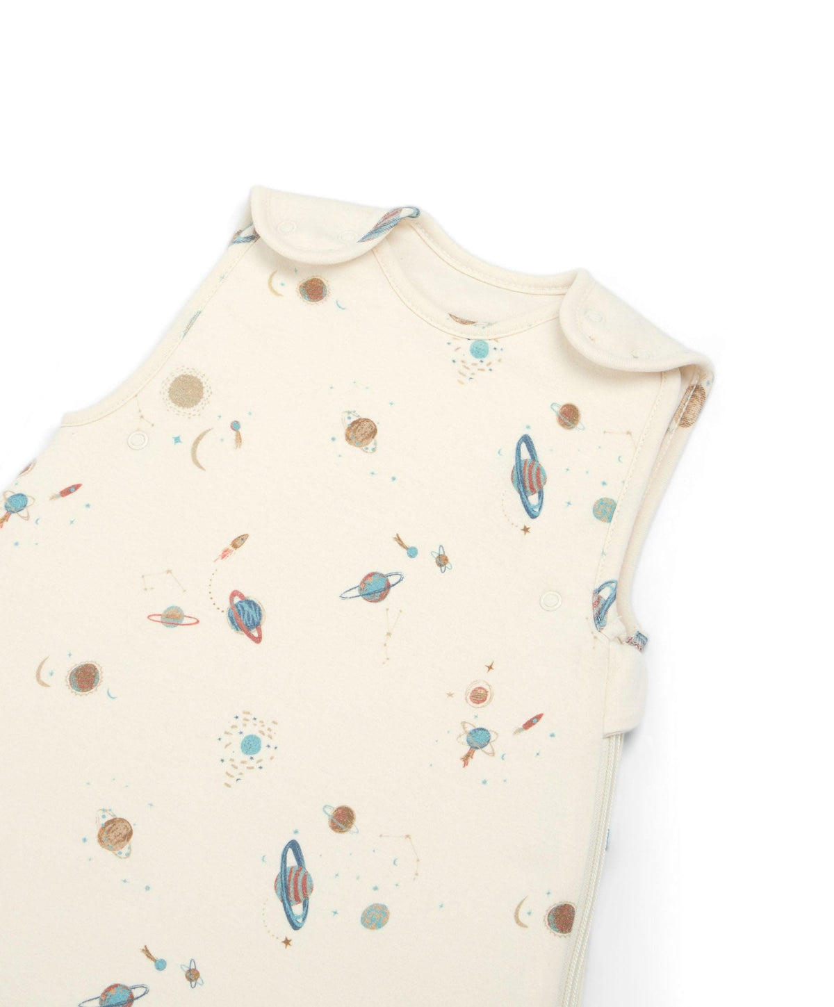 Cream sleeveless sleep bag with planet print, close-up view of front