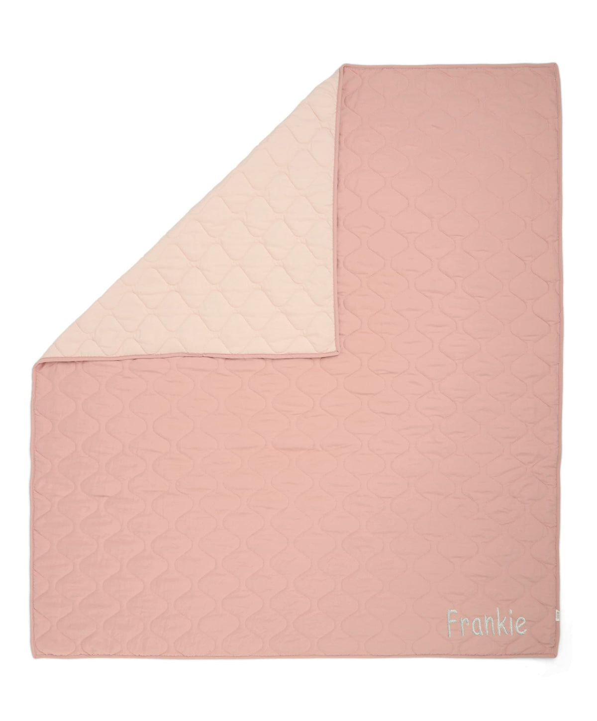 Reversible baby quilt, pink front with cream reverse panel and quilted circular texture