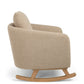 Fawn boucle nursing chair, side view with rounded backrest and rocking base