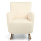 Off-white boucle nursing chair with padded armrests and wooden legs