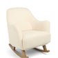 Off-white bouclé nursing chair with curved armrests and rocking base