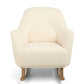 Off-white bouclé nursing chair with wide seat, rounded arms, and rocking base