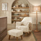 Off-white bouclé nursing chair with padded stool, curved wooden rocker base