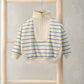 Off-white funnel neck jumper with blue stripe panels and half-zip front
