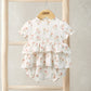 Peplum shortie romper on hanger, white floral print, tiered ruffles, short sleeves