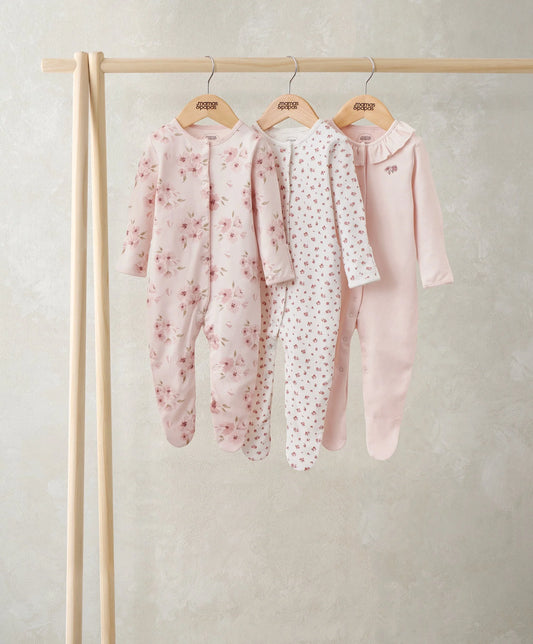 Set of 3 watercolour floral baby sleepsuits, pale pink with floral print and zip fronts