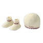 Cream knit baby hat and booties set with pink ribbed cuffs, Frankie label on hat