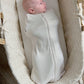 Oatmeal swaddle sleep sack with full-length zip and long sleeves