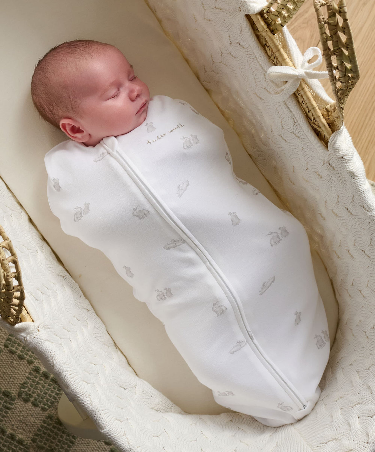 Bunny-print baby swaddle sleeping bag with zip front, white