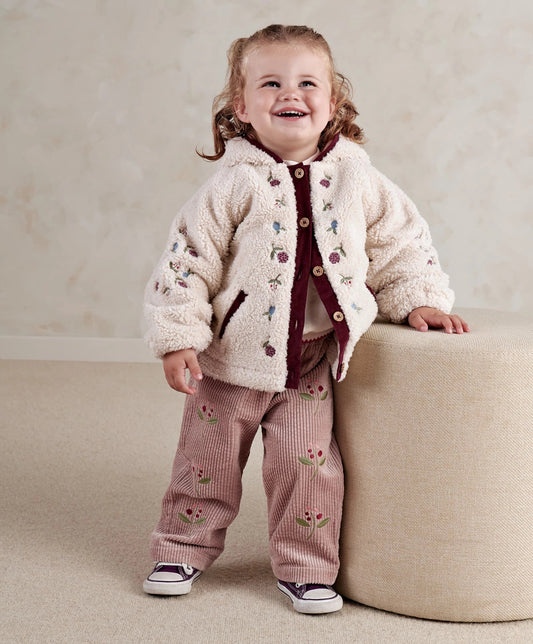 Cream borg jacket with embroidered motifs, burgundy zip front and hood for baby/toddler