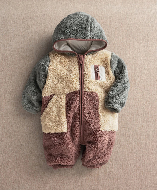 Color-block pramsuit with hooded front and buttoned zipper, gray sleeves, beige and plum panels