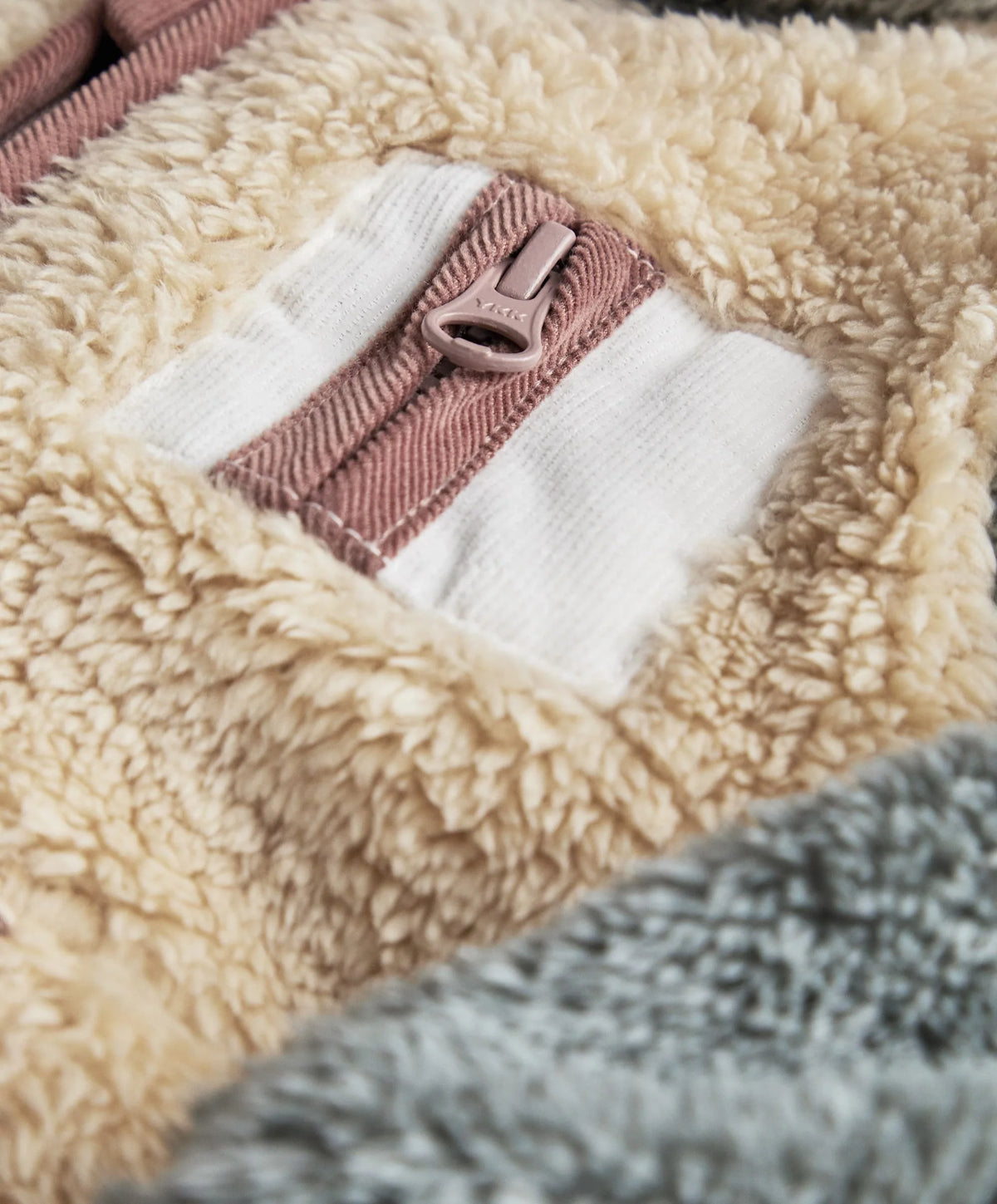 Color-block pramsuit with front zipper and hood, beige, taupe, and dark brown patches
