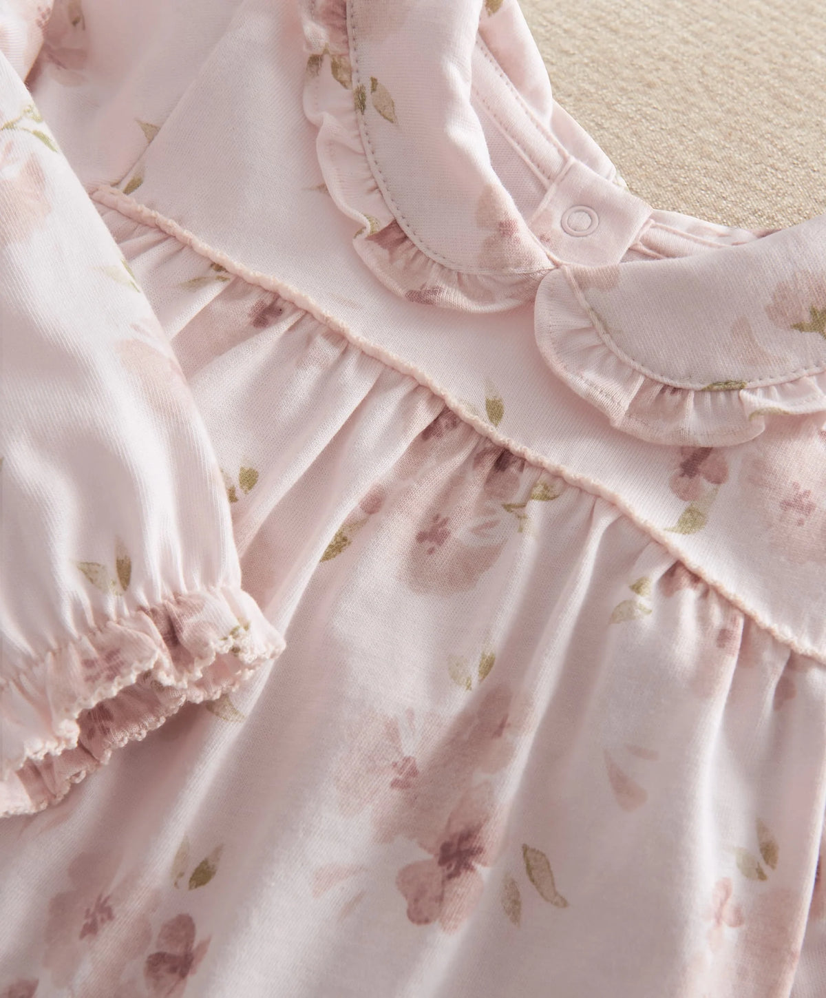 Pale pink floral jersey pyjama dress-style yoke with gathered seams and button detail