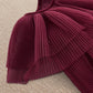 Burgundy pleated cape dress neckline with draped overlay