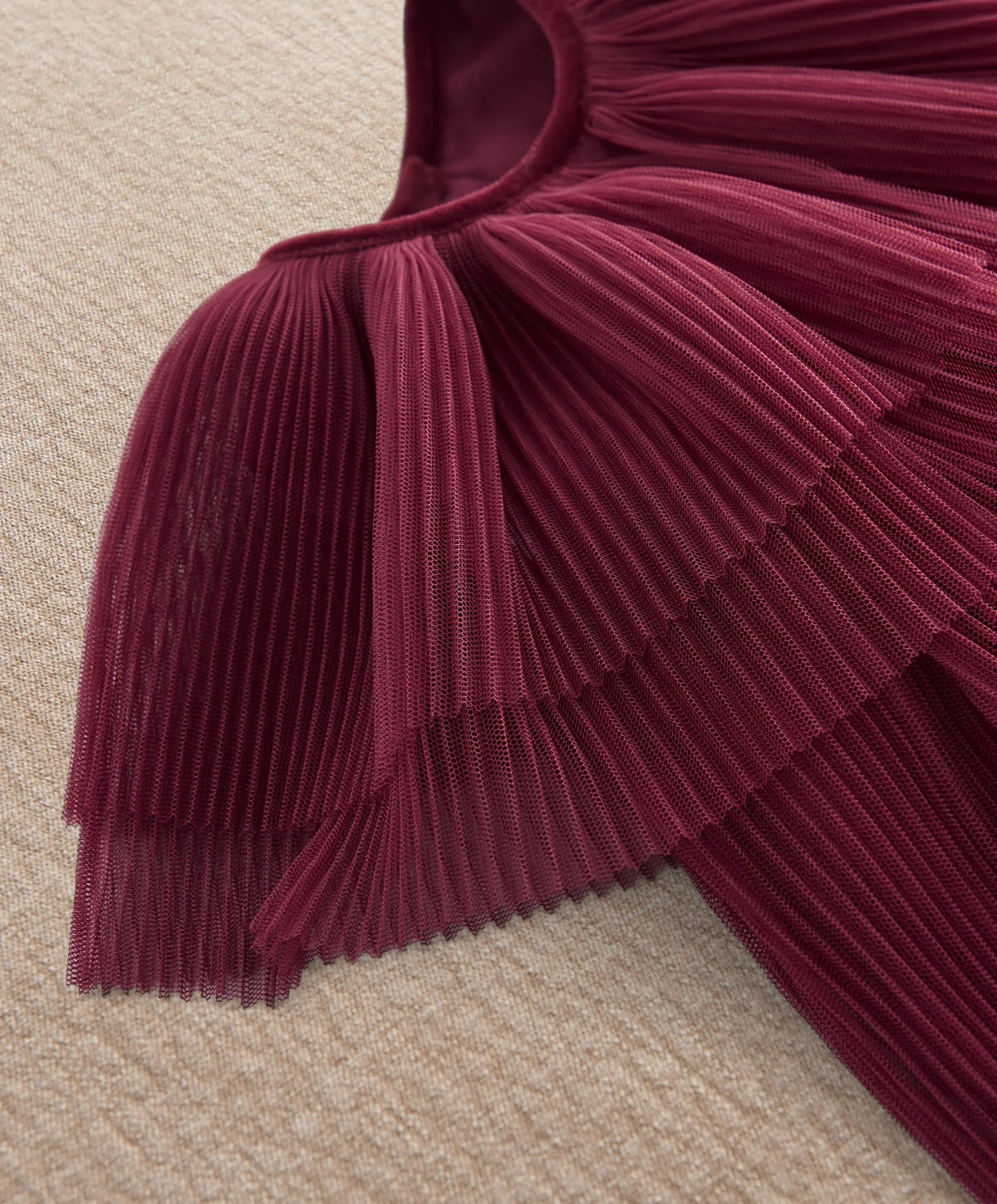 Burgundy pleated cape dress neckline with draped overlay