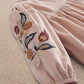 Light pink corduroy dress sleeve with floral bird embroidery and gathered puff cuff