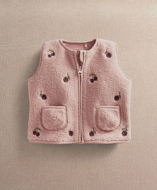 Pink fleece gilet with front zipper, two flap pockets, embroidered dot patches