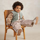 Kids borg gilet vest with fluffy light green-gray texture, brown trim, and four-button front