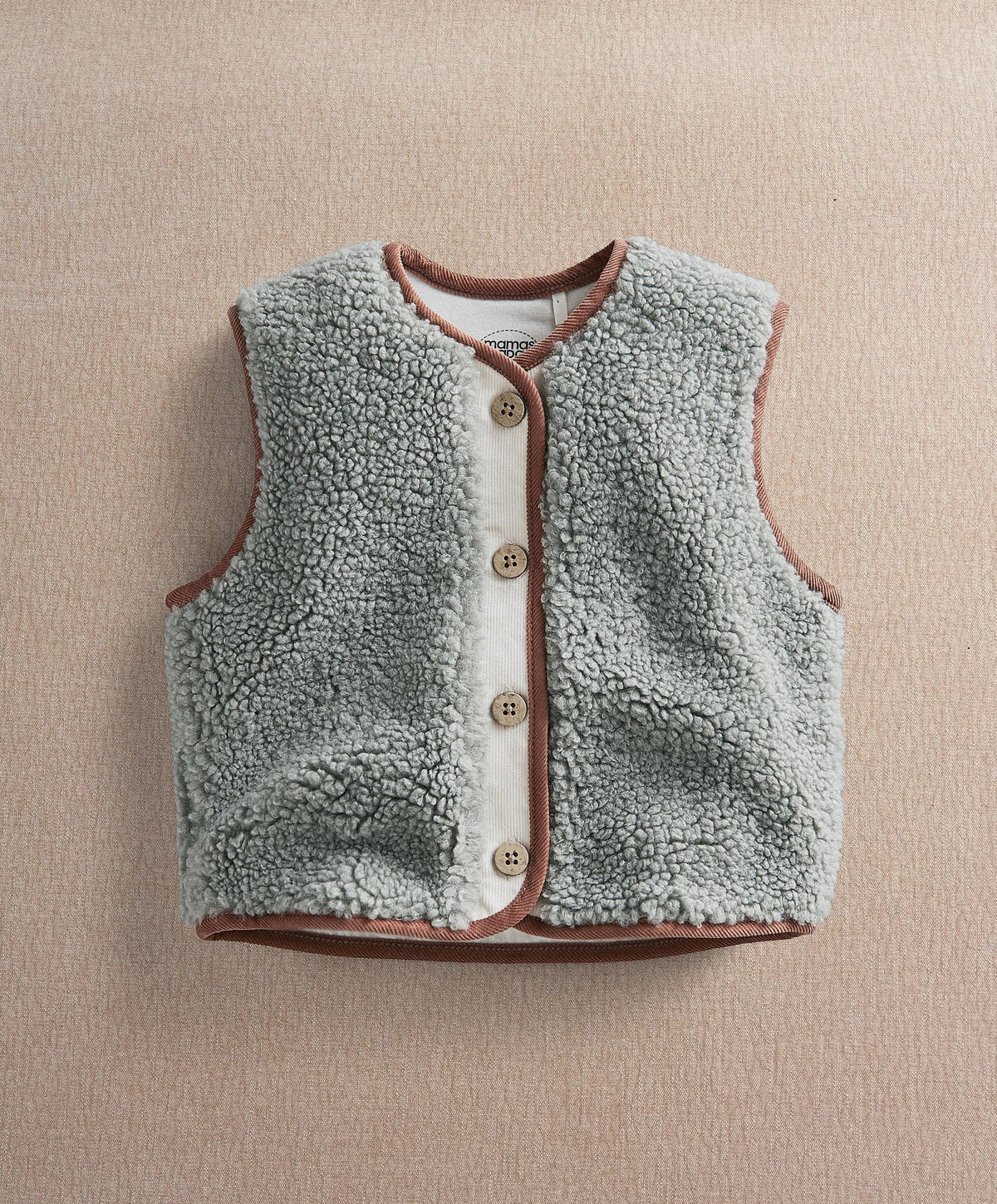 Borg gilet vest flat lay in light green-gray fleece with brown trim and button placket