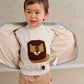Children's lion knit jumper, cream speckled with front lion patch; raglan sleeves