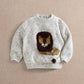 Children's lion knit jumper, cream speckled knit with brown and yellow lion front