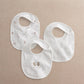 Three white baby bibs with brown animal prints, ribbed bib opening and snap fasteners