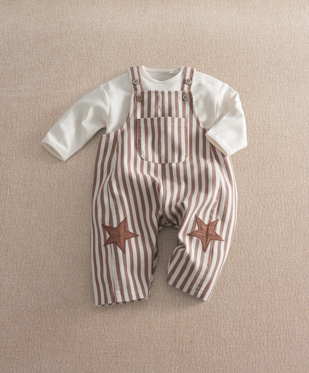 Striped dungaree set front view, brown-and-cream stripes, star knee appliques, button straps