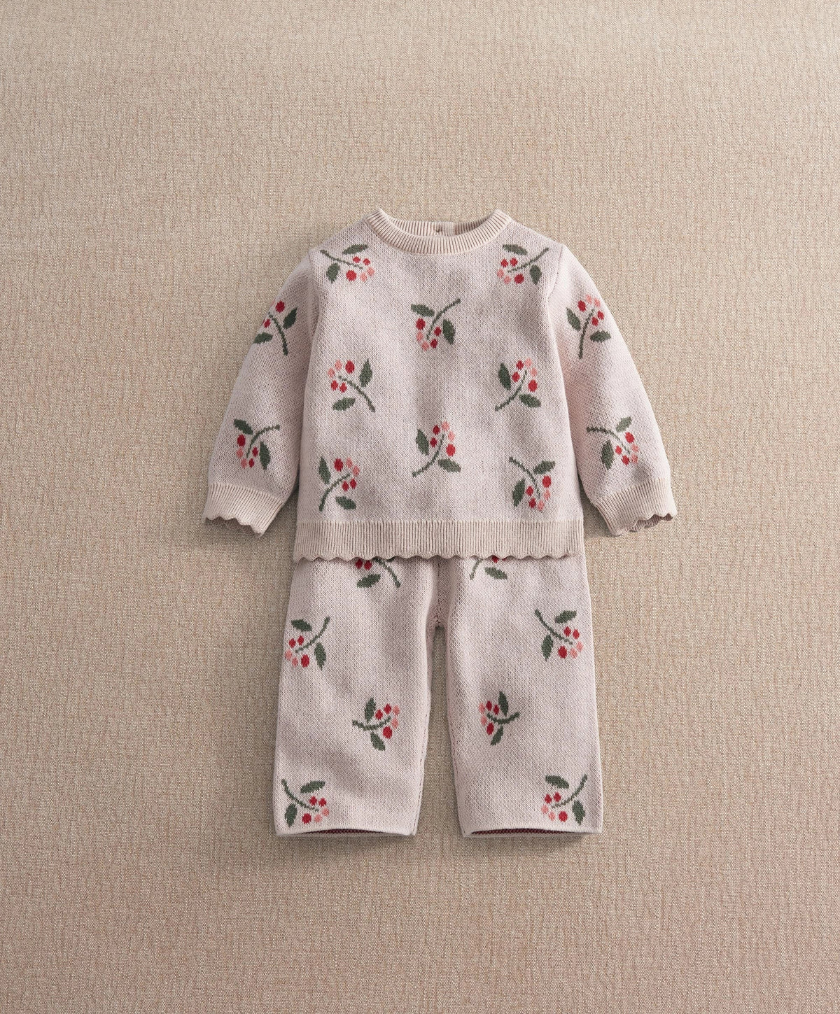 Knitted top and wide trousers set in light pink with berry print