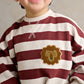 Striped romper with lion patch and front button placket, burgundy and cream
