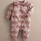 Pink floral knitted baby romper with long sleeves and button placket