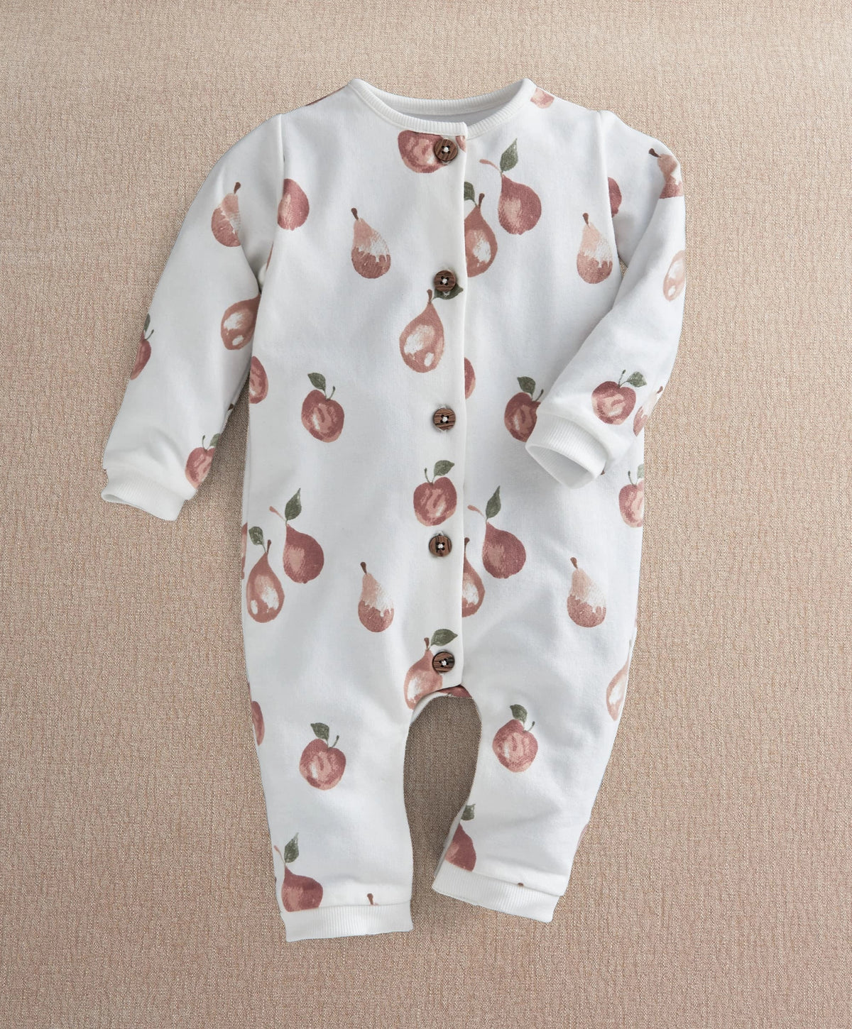 White long-sleeve fruit-print romper with front snap placket