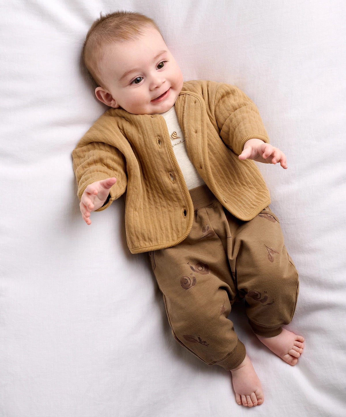 Tan button-front jacket and joggers set with allover snail prints