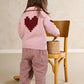 Pink knit heart cardigan with dark red heart intarsia and button placket, back view