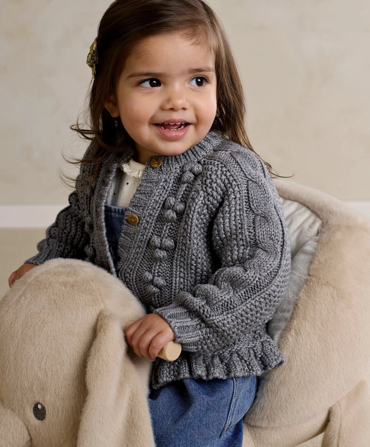 Gray knit bobble cardigan with button placket and textured sleeves