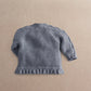 Gray knit cardigan back view with ribbed cuffs and textured hem