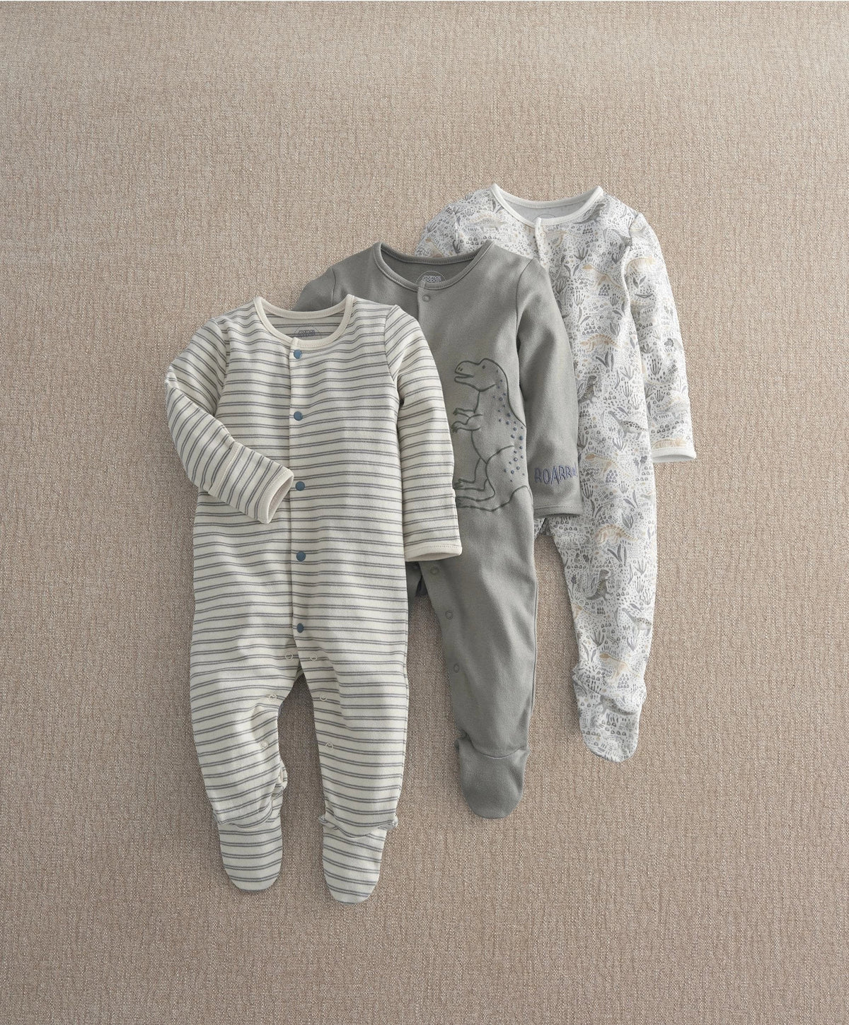 Pack of 3 baby sleepsuits: striped, dino graphic, and grey patterned