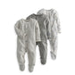 Pack of 3 baby sleepsuits in grey tones: striped, dino, and patterned