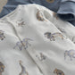 White safari animal-print romper with snaps and long sleeves
