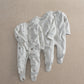 White sleepsuit set: zip-front plain style plus printed all-over sleepers