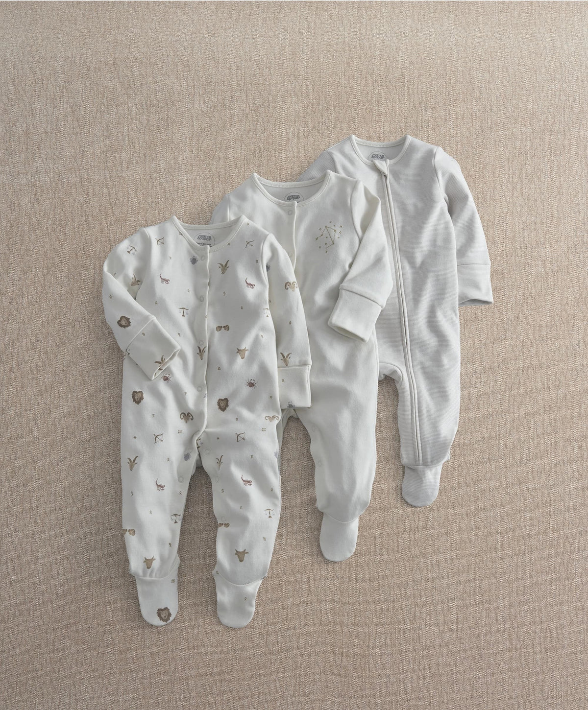 White sleepsuit set: zip-front plain style plus printed all-over sleepers
