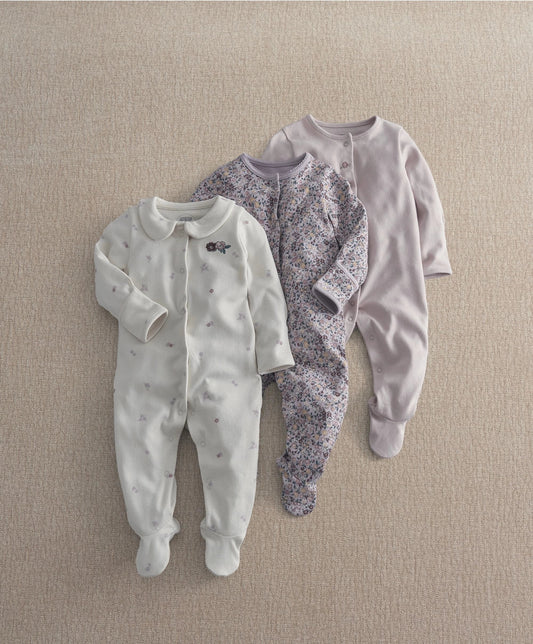 Pack of 3 floral sleepsuits: white tiny-flower, purple floral, and lilac solid.