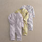 Baby floral romper set of three: striped, yellow floral, and light floral sleeves