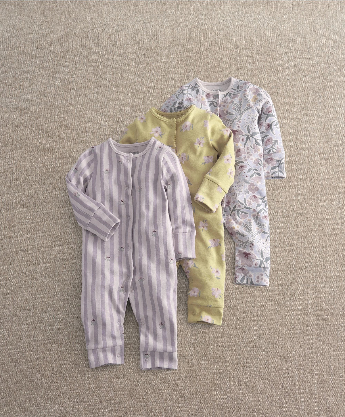 Baby floral romper set of three: striped, yellow floral, and light floral sleeves