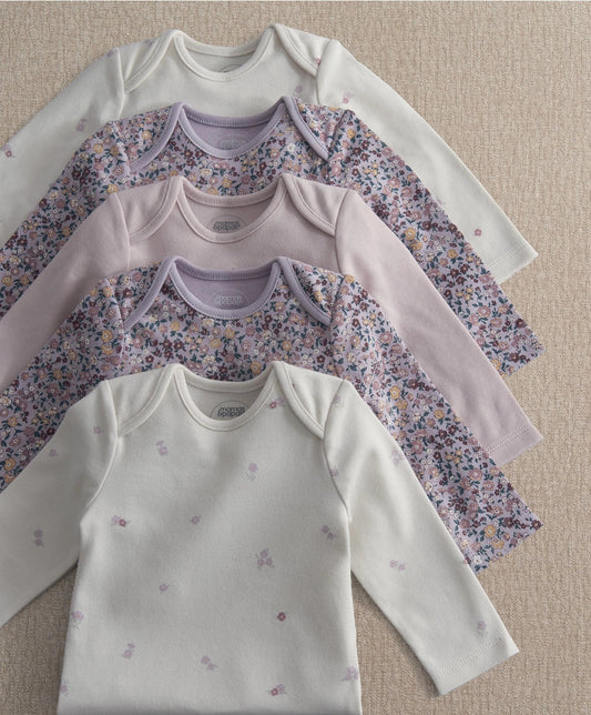 Five long-sleeve bodysuits in light lavender and white, floral prints with snap buttons