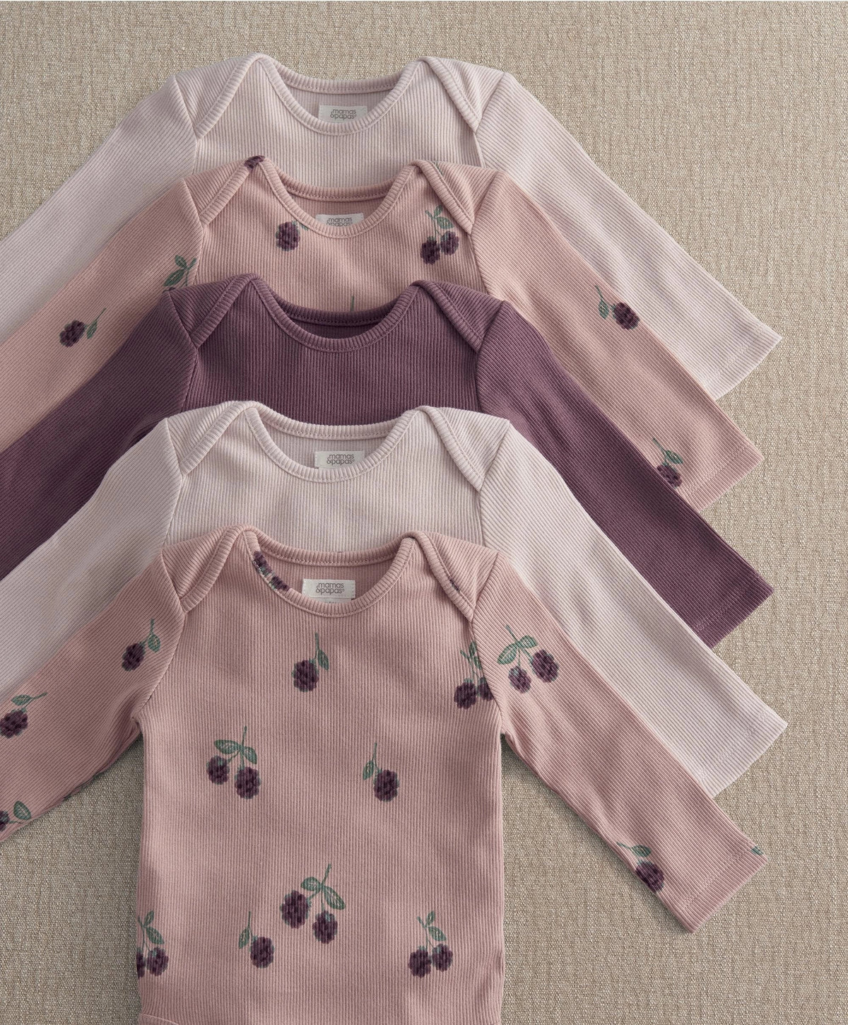 5-pack baby bodysuits: pale pink, plum purple, and light pink with berry print