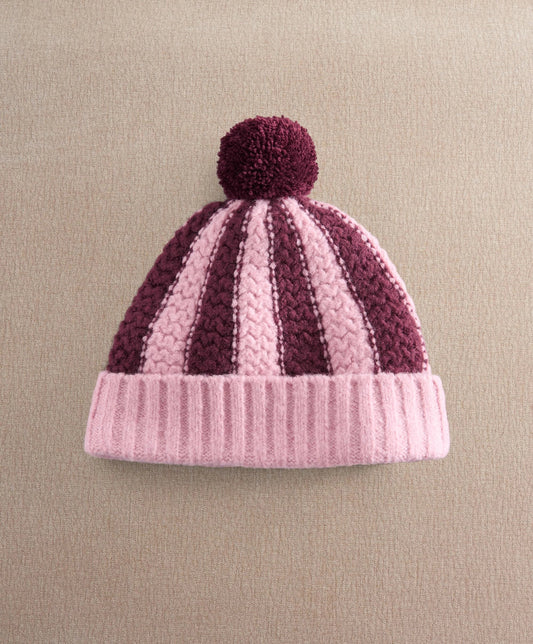 Striped knitted pom pom hat, pink and dark plum with ribbed brim