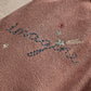 Applique trousers side embroidery with small stars and a stitched blue decorative line