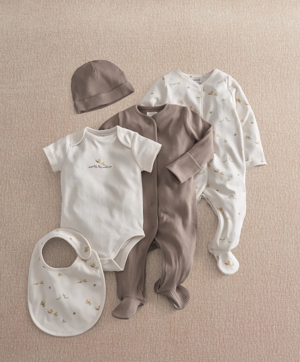 5-piece baby clothing set with gray hat, gray outfit, white printed footie, bib, bodysuit