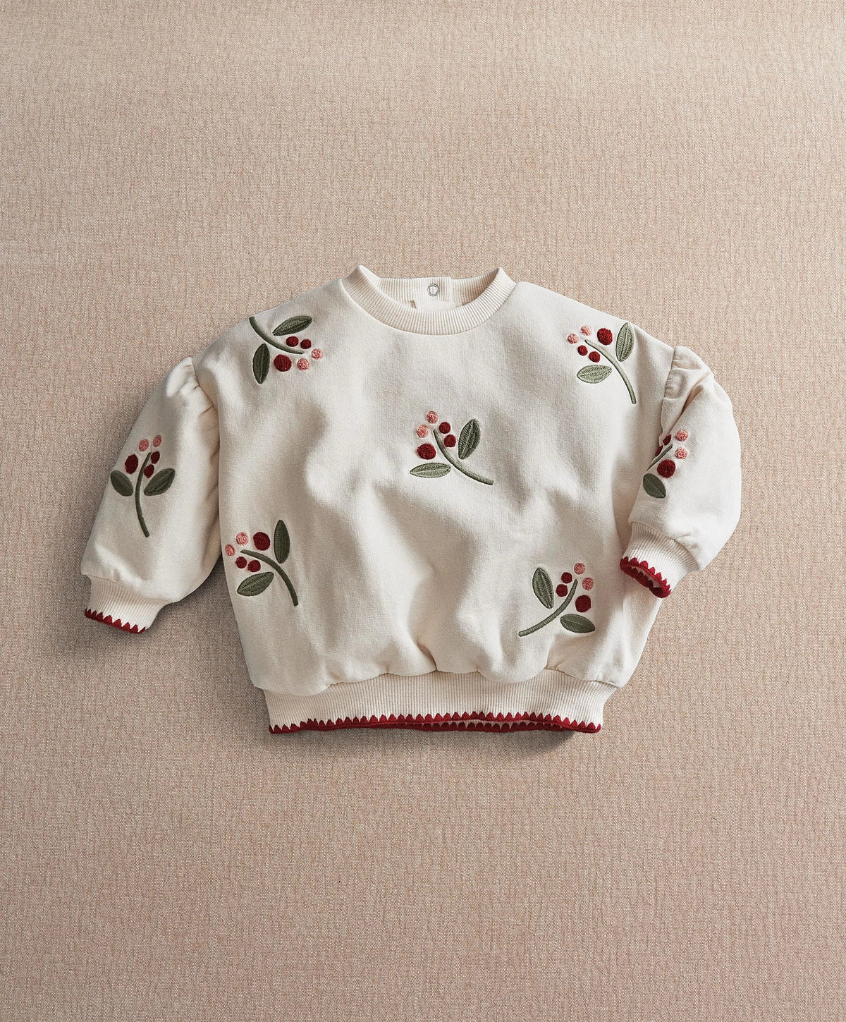 Cream berry sweatshirt with full front berry and leaf motif, long puff sleeves